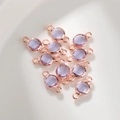 Detail van 6mm lichtpaarse kristallen geboortesteen bedeltjes met roségouden dubbele lussen - 6mm / Rozegoud Juni (P2456)