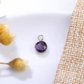 Close-up of a 6mm purple birthstone pendant with faceted crystal on a rustic background - 6mm / Silver-Purple (Feb)