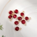 Detailed view of dark red 6mm faceted birthstone pendants with gold hanging loops - 6mm / Gold-Red (Jan)