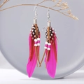 Bohemian long feather earrings with vibrant rose pink accents and tribal beads - Rose Red