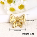 Detailed size view of a gold bow pendant with zircon crystals measuring 2.5cm by 2.2cm - Rhinestone Bow (A0225)