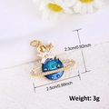 Detailed view of a gold-plated astronaut and blue enamel planet charm with zircons - Astronaut Explorer Style (A0105)