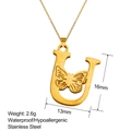 Macro shot of gold stainless steel U-letter pendant with hollow butterfly detail - Butterfly Letter U (U-XL0212)