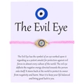 Pink braided evil eye bracelet with gold plating and blue crystals on a meaning card - Textured Round Eye (B0020)