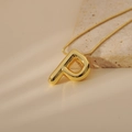 Detail of a 3D bubble letter P gold pendant on a sleek snake chain over stone - Letter P Style (24WN028)