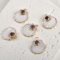 Macro detail of gold-plated fan-shaped shell pendants with purple amethyst inlay work - Amethyst Shell (A1-283)