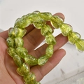 Close-up of heart-shaped light green glass beads with gold foil for DIY jewelry making - 5# Olive Green Iridescent Heart