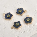 Detailed macro view of four gold-edged flower pendants with blue lapis lazuli stones - Lapis Lazuli