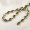 Macro shot of rhombus glass beads with gold plated edges for DIY jewelry making - 15.2*10.2mm / Lake Blue Rhombus