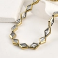 Makroaufnahme von rautenförmigen Glasperlen mit vergoldetem Rand für DIY-Schmuckdesign - 15.2*10.2mm / Transparent Weiß Rhombus