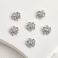 Détail de six pendentifs noeuds en argent avec zircons roses pour création de bijoux DIY - Zirconia Rose Nœud Argent Rhodié (10,6x10mm)
