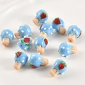 Detailed view of handmade lampwork mushroom beads with red strawberry and white polka dots - Lake Blue Strawberry (6#Lake Blue Strawberry)
