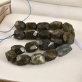 Macro shot of faceted natural labradorite loose beads showing blue flash and rectangular cut - Larvikite / 1 Piece