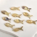 Macro shot of 10-piece fish-shaped iridescent natural shell pendants for DIY jewelry - Abalone Shell Fish