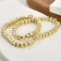 Macro shot of 6mm gold plated volcanic lava cube spacer beads for jewelry making - Square / Light gold