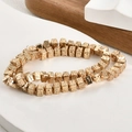 Macro shot of 6mm gold plated square lava stone spacer beads for DIY jewelry making - Square / KC Gold