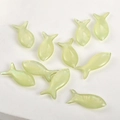 Macro view of translucent fish-shaped resin charms with holes for jewelry DIY making - Light Green Fish