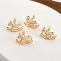 Macro detail of four gold-plated 18k flying horse charms with pink and blue enamel - Pink Pegasus Style