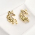 Detailed macro view of 14k gold plated unicorn pendants with sparkling cubic zirconia inlay - 14K Gold Full Zirconia Unicorn / 23.8x14.3mm