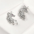 Macro shot of 14k gold-plated unicorn charms with cubic zirconia inlay for DIY jewelry - Silver Tone Full Zirconia Unicorn / 23.8x14.3mm