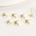 Detailed macro view of 14k gold plated cross snowflake earring charms with orange zircon - 14k Gold Plated Red Zircon Cross