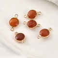 Macro detail of red faceted crystal connectors with gold-plated edges for DIY jewelry - Red Agate