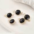 Close-up of faceted blue sandstone round charms with gold-plated connectors for jewelry - Blue Sandstone