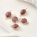 Detailed macro view of 5 rose-hued faceted crystal connectors with gold plated edges - Rhodonite