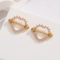 Detail of gold heart nipple ring with pink zircon pave on a white stone background - Gold Pink