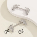 Macro shot of silver skull hand nipple barbells with precise size measurements - Skeleton Palm