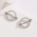 Detailed macro view of 18K gold-plated stainless steel nipple rings with cubic zirconia - Silver