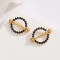 Detail of 18K gold-plated stainless steel nipple rings with blue cubic zirconia stones - Gold Blue