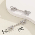 Detail of silver bow nipple ring with white zircons showing 3.4cm length dimension - Bow