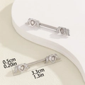Macro view of winged heart nipple bar with zirconia inlay and 33mm length detail - Heart Wings