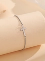 Minimalist silver stainless steel chain bracelet featuring a cross charm on a display stand - Cross