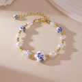 Blue and white ceramic heart bracelet with elegant pearls and gold beads for women - Pentagram