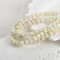 Macro shot of 6mm faux jade square glass beads with silver spacers for DIY jewelry - One Strand Approx 55 Beads / Korean Green
