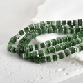 Macro shot of square green striped glass beads and silver spacers for DIY jewelry making - One Strand Approx 55 Beads / Malachite Green