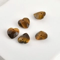 Detail of five faceted heart-shaped tiger eye stone beads for DIY jewelry making - Tiger Eye Heart