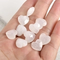 Macro view of 13mm heart-shaped faceted natural rose quartz beads for DIY jewelry - Clear Quartz Heart