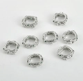 Macro view of 14k gold-plated hollow square spacer beads with green zircon accents - White Gold