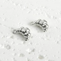 Macro detail of silver croissant-shaped 14k gold plated charms for jewelry making - Croissant Style (A1-6) / Silver