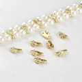 Macro view of 14k gold-plated Mickey-shaped spacers with cubic zirconia for DIY jewelry - Cartoon Head Double Hole (9.7*4.5mm)
