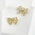 Macro view of 14k gold plated bow pendant with cubic zirconia for jewelry making - Zirconia Bow Style / Gold
