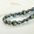 Macro detail of dark blue art glass beads with sparkling colorful foil inclusions - 2# Lake Blue Foil Flat Round