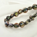 Macro shot of glass spacer beads with colorful metallic foil flakes on white ceramic - 3# Champagne Foil Flat Round