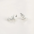 Detailed view of silver snake stud earrings with realistic textured scale patterns - Silver