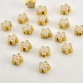 Detailed macro of 18k gold gradient enamel flower beads for DIY jewelry making - Gold Blue Pink Flower