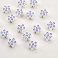 Detailed macro view of 18k gold blue and purple enamel flower beads for DIY jewelry making - Silver Purple Blue Flower
