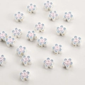 Detailed close-up of 18k gold gradient blue enamel flower spacer beads for DIY jewelry - Silver Blue Pink Flower